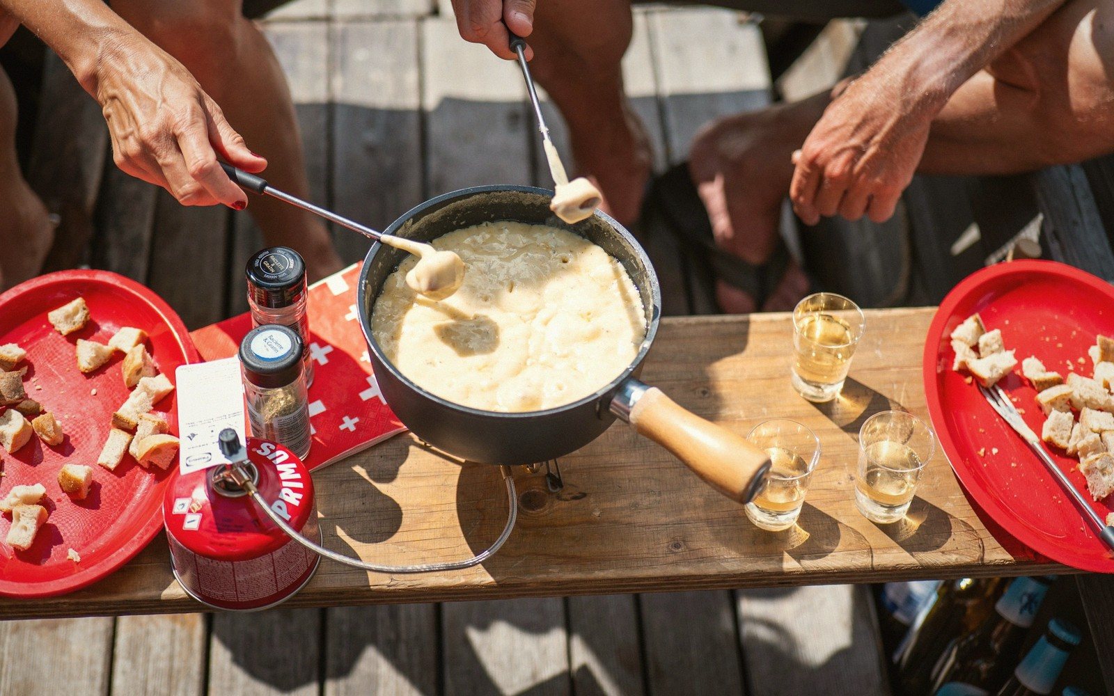 Savoyard tartiflette and fondue on a chalet table
